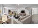 Open-concept living room featuring modern decor, stylish furnishings, and an inviting atmosphere for relaxation at 815 Savona Pl, Kissimmee, FL 34758