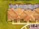 Aerial view of townhomes with private pools and brown tile roofs at 8959 Stinger Dr, Champions Gate, FL 33896