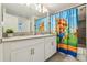 Bathroom with dual sinks, shower/tub combo, and tile floors at 8959 Stinger Dr, Champions Gate, FL 33896