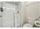 Bathroom featuring an all-glass standing shower and a toilet with Super Mario Brothers themed wall decor at 8959 Stinger Dr, Champions Gate, FL 33896