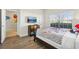 Comfortable bedroom with a bed and TV. Large window provides natural light at 8959 Stinger Dr, Champions Gate, FL 33896