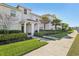 Townhouse exterior boasting well-maintained landscaping and a covered entryway at 8959 Stinger Dr, Champions Gate, FL 33896