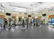 Bright fitness center features multiple exercise machines, tvs and plenty of natural light at 8959 Stinger Dr, Champions Gate, FL 33896