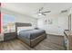 Tranquil main bedroom with neutral tones, a large bed, and hardwood floors at 8959 Stinger Dr, Champions Gate, FL 33896