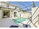 Backyard oasis with a private pool and screened-in lanai offers relaxation and fun in the sun at 8959 Stinger Dr, Champions Gate, FL 33896