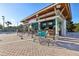 Inviting poolside bar with seating, a counter, and tropical accents at 8959 Stinger Dr, Champions Gate, FL 33896