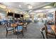 Well-lit restaurant with a bar and tables and chairs at 8959 Stinger Dr, Champions Gate, FL 33896