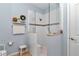 Modern bathroom featuring walk-in shower, tile details, and convenient fixtures at 9491 Sw 98Th Ct, Ocala, FL 34481