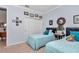 Comfortable bedroom with twin beds, carpet flooring, and a closet for ample storage at 9491 Sw 98Th Ct, Ocala, FL 34481