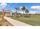 Community space with Veterans Pavilion, landscaping, palm trees, and shade relief at 9491 Sw 98Th Ct, Ocala, FL 34481