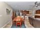 Cozy dining room area with wooden furniture adjacent to kitchen and living spaces at 9491 Sw 98Th Ct, Ocala, FL 34481
