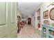 Welcoming foyer featuring tile flooring, elegant decor, and a view into the dining and living areas at 9491 Sw 98Th Ct, Ocala, FL 34481