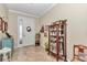Inviting foyer featuring tiled floors, decorative accents, and a view of the entrance at 9491 Sw 98Th Ct, Ocala, FL 34481