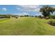 Scenic view of a lush green golf course, offering a serene and recreational experience for golf enthusiasts at 9491 Sw 98Th Ct, Ocala, FL 34481