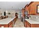 Modern kitchen features an island with seating, stainless steel appliances, and stylish cabinetry at 9491 Sw 98Th Ct, Ocala, FL 34481