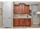 Built-in kitchen cabinet with counter top, wine rack and a white interior door at 9491 Sw 98Th Ct, Ocala, FL 34481