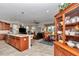 Open floor plan with modern kitchen island, cozy living room, and dining area creates an inviting space at 9491 Sw 98Th Ct, Ocala, FL 34481