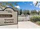 Victory Garden sign at On Top of the World community with raised garden beds in the background at 9491 Sw 98Th Ct, Ocala, FL 34481