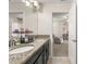 Bathroom with granite countertops, double sinks, tiled floor and access to multiple rooms at 9844 Pecan Hickory Way, Orlando, FL 32832