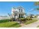 Charming two-story home with a welcoming front porch at 9844 Pecan Hickory Way, Orlando, FL 32832
