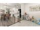 Living area features a dining area, kitchen, and safety gate at 9844 Pecan Hickory Way, Orlando, FL 32832