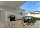 Outdoor patio with a grill, string lights, and stylish seating area for outdoor enjoyment at 9844 Pecan Hickory Way, Orlando, FL 32832