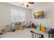 Bright playroom featuring light gray carpet, and a ceiling fan at 9844 Pecan Hickory Way, Orlando, FL 32832