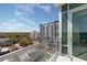 Relaxing balcony view showcasing the city skyline and blue skies in a modern residence at 101 S Eola Dr # 910, Orlando, FL 32801