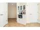 Compact kitchenette with storage cabinet and tiled flooring at 101 S Eola Dr # 910, Orlando, FL 32801