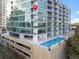 Upscale condo building featuring a pool on the parking structure, with an attached pin showcasing unit location at 101 S Eola Dr # 910, Orlando, FL 32801