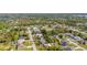 An aerial shot of the home, displaying its position amidst a well-maintained neighborhood with mature landscaping at 1061 Radford Dr, Deltona, FL 32738