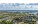 Aerial view showing house in a neighborhood with several nearby lakes at 1061 Radford Dr, Deltona, FL 32738