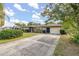 Charming single story home featuring a well-maintained lawn and a concrete driveway at 1061 Radford Dr, Deltona, FL 32738