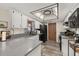 White kitchen with a view of stainless steel appliances and light countertops at 1061 Radford Dr, Deltona, FL 32738