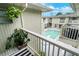 Balcony view overlooking the community swimming pool with multiple floors of apartments at 1120 Portland Ave # 2, Orlando, FL 32803