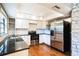 Well-lit kitchen featuring stainless steel appliances, granite countertops, and white subway tile backsplash at 1120 Portland Ave # 2, Orlando, FL 32803