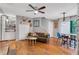 Well-lit living room with hardwood floors, built-in shelving, and a cozy seating area at 1120 Portland Ave # 2, Orlando, FL 32803