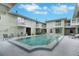 Community pool surrounded by well-maintained two-story condo buildings at 1120 Portland Ave # 2, Orlando, FL 32803