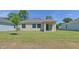Spacious backyard and covered patio provide a private and tranquil outdoor retreat at 144 Jones Fish Camp Rd, Edgewater, FL 32141
