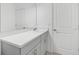 Clean, spacious bathroom featuring gray cabinets, modern fixtures, and a white quartz countertop at 144 Jones Fish Camp Rd, Edgewater, FL 32141