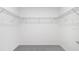Walk-in closet, providing ample storage with wire shelving and carpeting at 144 Jones Fish Camp Rd, Edgewater, FL 32141