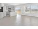 Open layout with kitchen featuring stone counter island and view to backyard at 144 Jones Fish Camp Rd, Edgewater, FL 32141