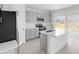 Modern kitchen with stainless steel appliances, stone countertops, and sleek cabinetry at 144 Jones Fish Camp Rd, Edgewater, FL 32141