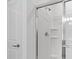 Modern shower featuring sliding glass doors, modern fixtures, and white trim at 144 Jones Fish Camp Rd, Edgewater, FL 32141