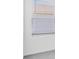 Bright interior shot of a room showcasing a window with blinds at 144 Jones Fish Camp Rd, Edgewater, FL 32141