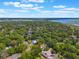 Aerial view of a neighborhood with beautiful homes and lush greenery near the water at 1511 Grandview Blvd, Kissimmee, FL 34744