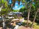 Aerial view of a cozy single-story home with mature trees and a curved walkway at 1511 Grandview Blvd, Kissimmee, FL 34744