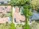 Stunning aerial view of the property showcasing the house, pool, and landscaped yard at 1630 Lasbury Ave, Winter Park, FL 32789