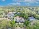 Aerial view of house with terra cotta roof highlighted within property lines at 1630 Lasbury Ave, Winter Park, FL 32789