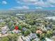 Drone shot of the house in it's neighborhood with a red pin to show its location at 1630 Lasbury Ave, Winter Park, FL 32789